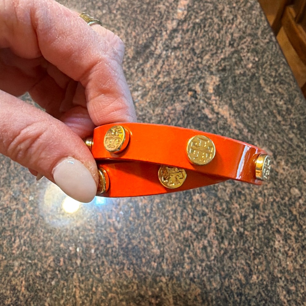 Tory Burch Orange Accessory with Gold Details for the wrist. Wrap bracelet